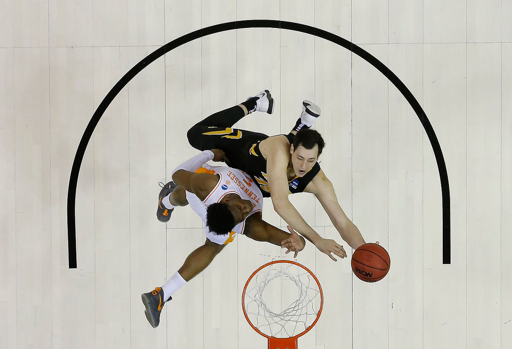 Story - 3rd placeTennessee guard Admiral Schofield (5) defends Iowa forward Ryan Kriener (15) under the basket during the first half of an NCAA tournament second-round game at Nationwide Arena in Columbus.(Adam Cairns / The Columbus Dispatch)